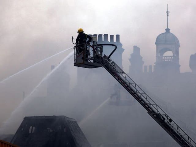 Firefighters attend the blaze at at the Newington Library on Walworth Road, Southwark