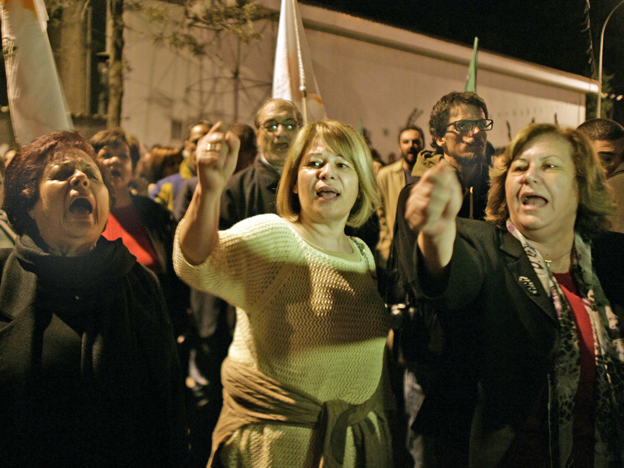 Protestors shout slogans against EU at protest outside a Eurogroup meeting at the European Council building last night
