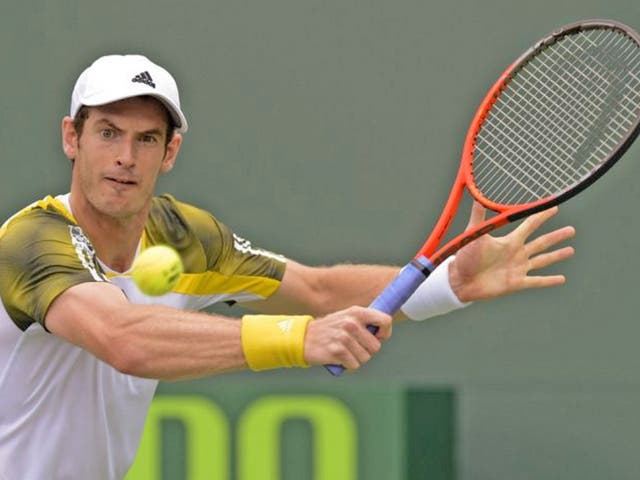 Andy Murray returns the ball to Grigor Dimitrov of Bulgaria during their third round match at the Sony Open tennis tournament in Miami, Florida