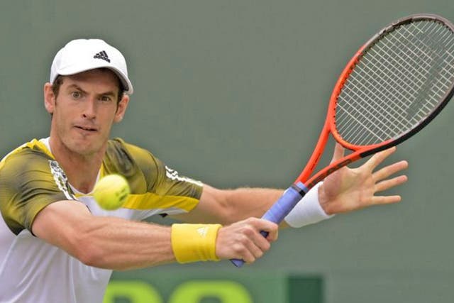 Andy Murray returns the ball to Grigor Dimitrov of Bulgaria during their third round match at the Sony Open tennis tournament in Miami, Florida
