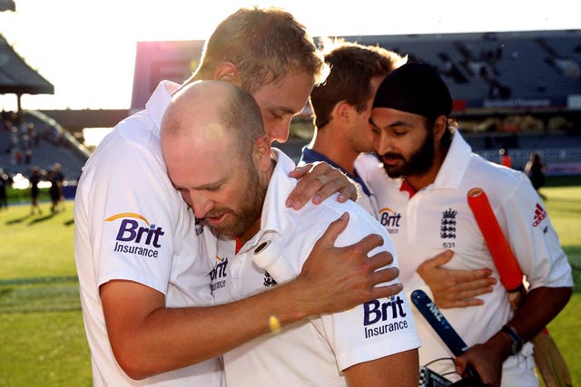Matt Prior of England is hugged by Stuart Broad as he leaves the field with Monty Panesar at the end of day five of the Third Test match against New Zealand 
