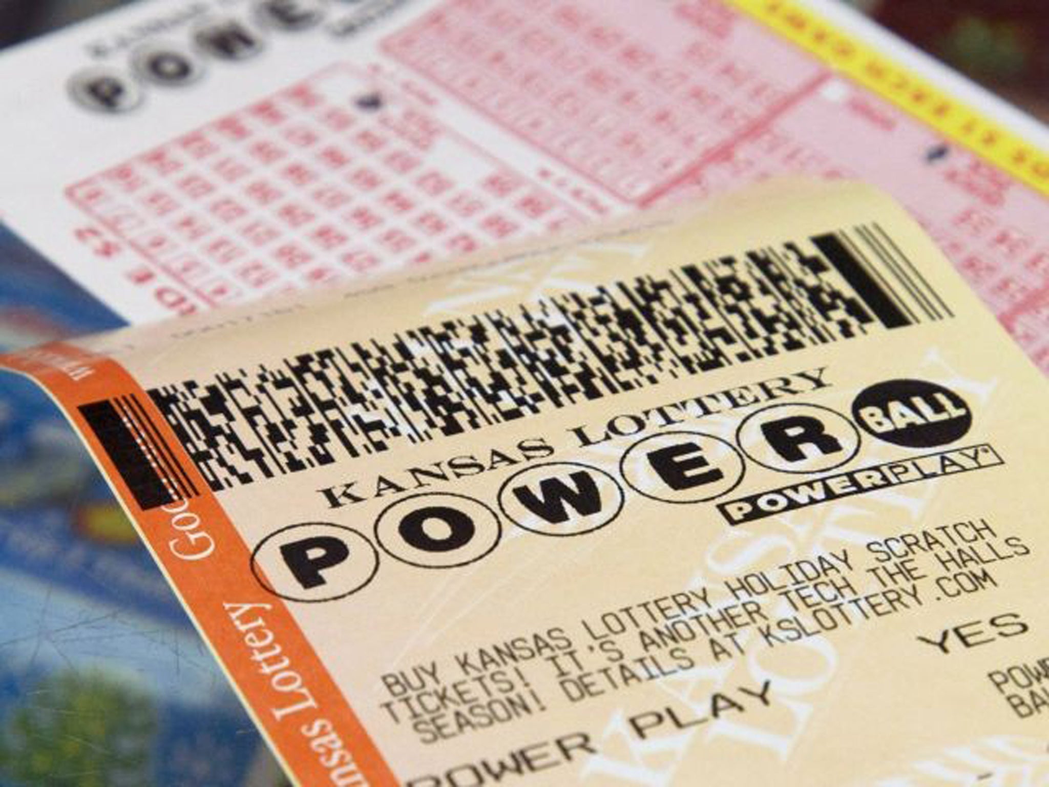 A Powerball form and purchased ticket
