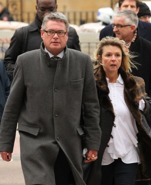The deputy editor of The Sun, Geoff Webster, arrives at Westminster Magistrates' Court in London with his wife Alison