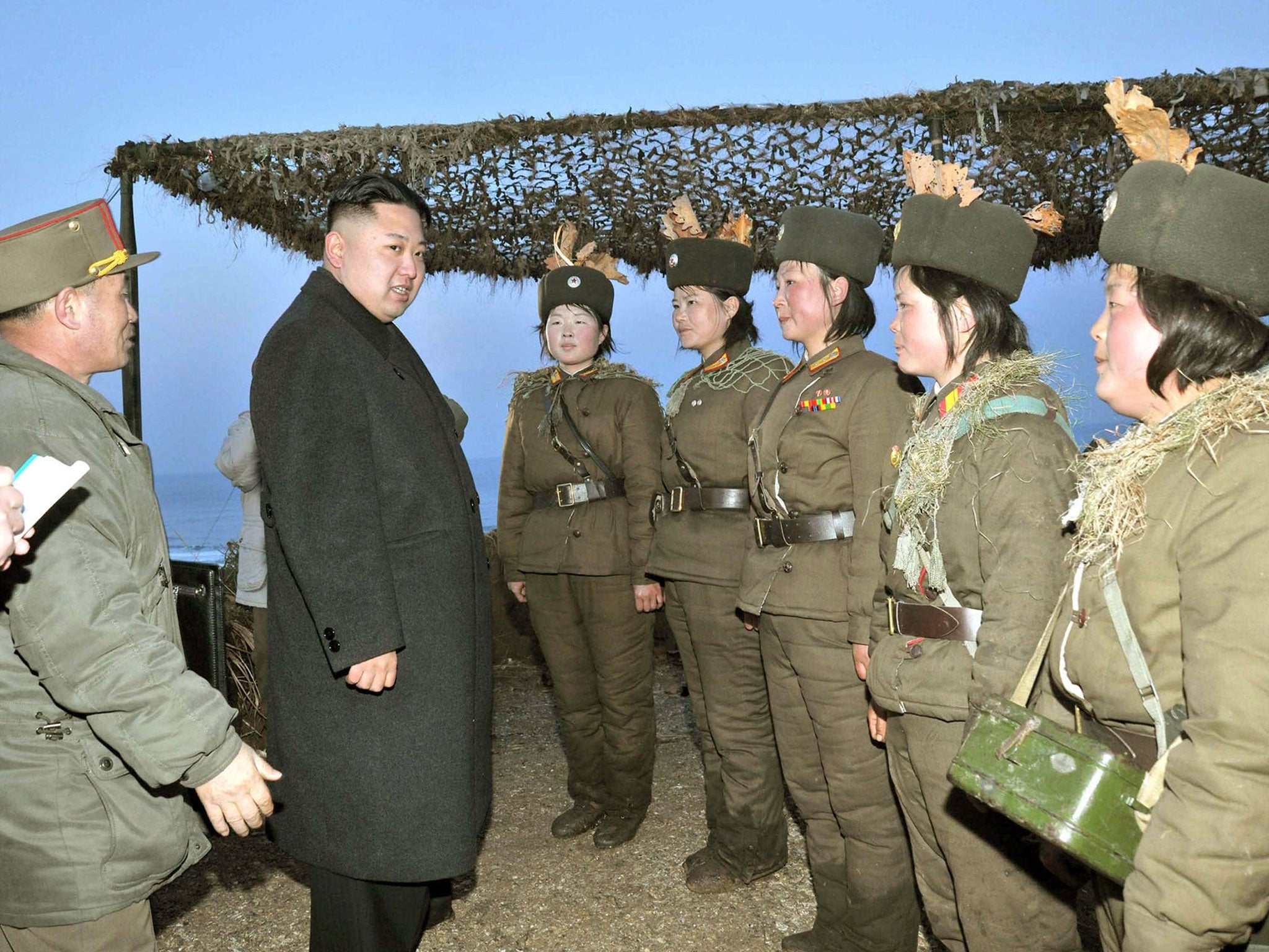 Kim Jong-un talks with soldiers taking part in anti-landing drills on the country’s east coast