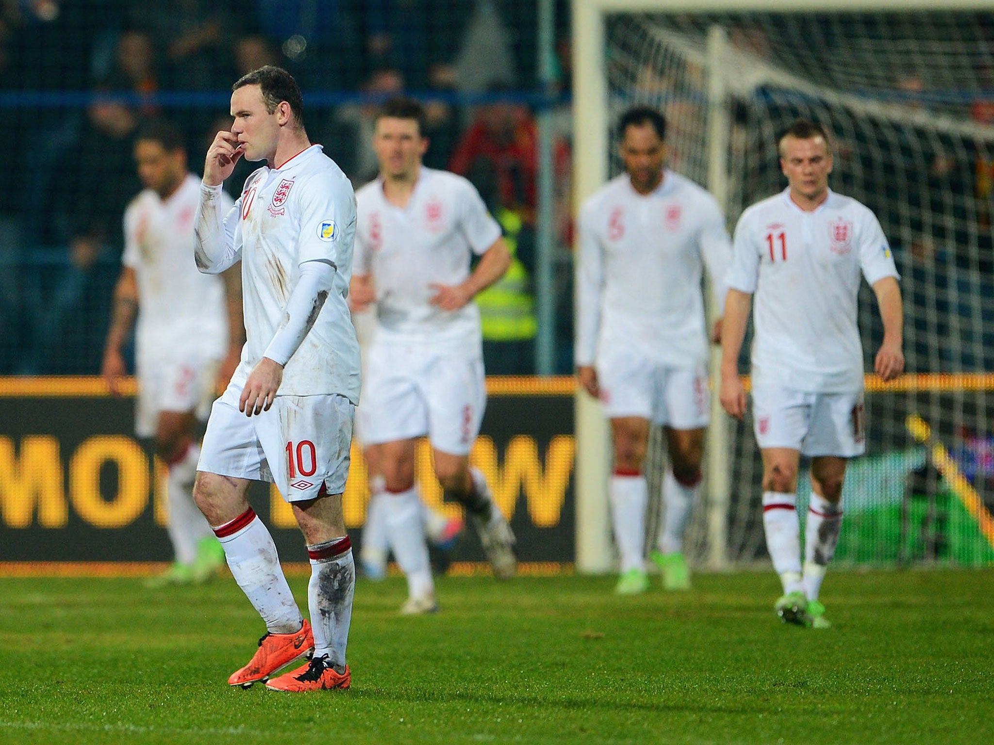 Wayne Rooney walks off at the end after England let slip his lead
