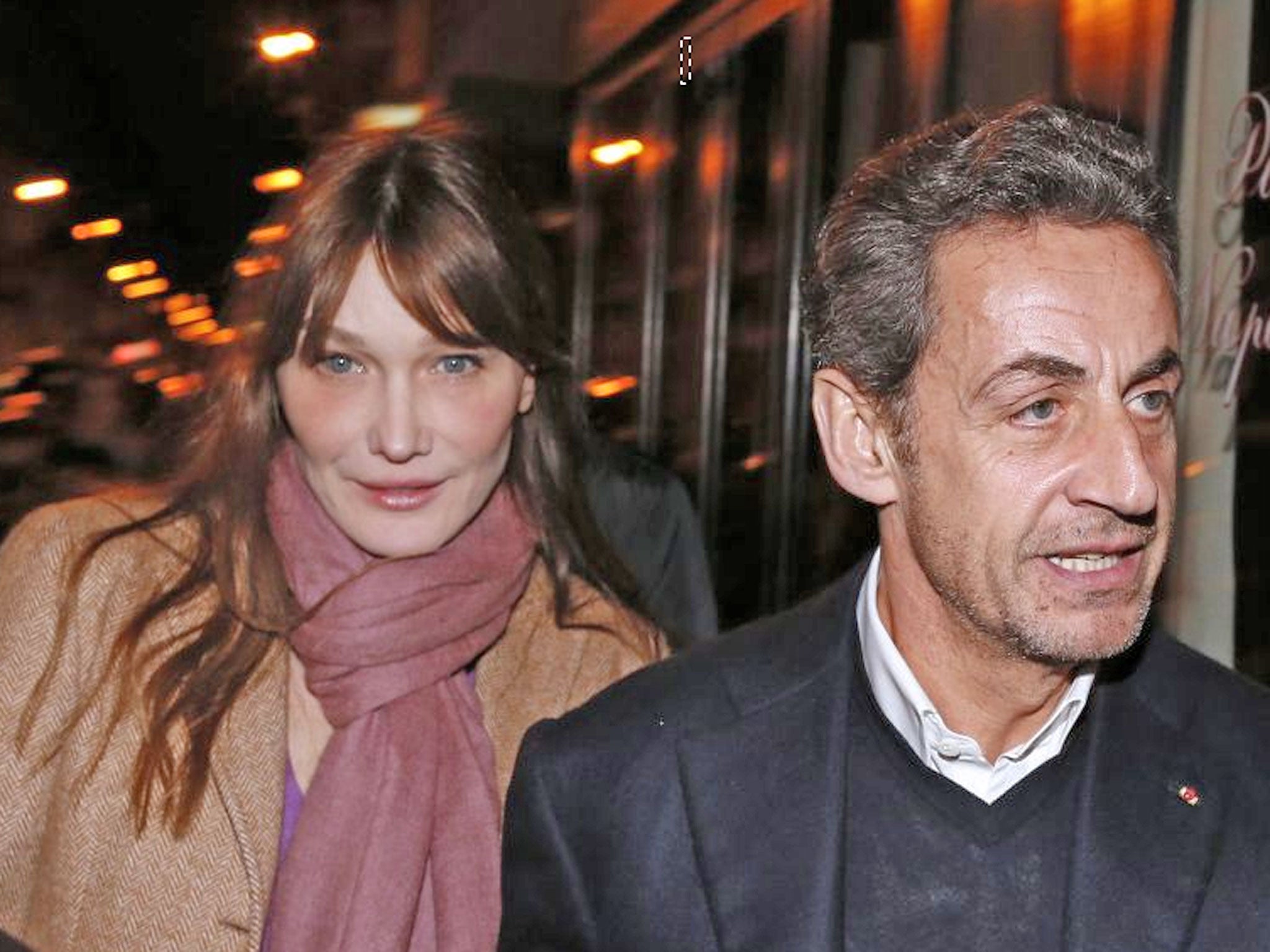A tearful Carla Bruni,left, has dismissed as “unthinkable” the accusation that her husband, Nicolas Sarkozy, right, took advantage of the mental frailty of an elderly billionaire to finance his rise to power