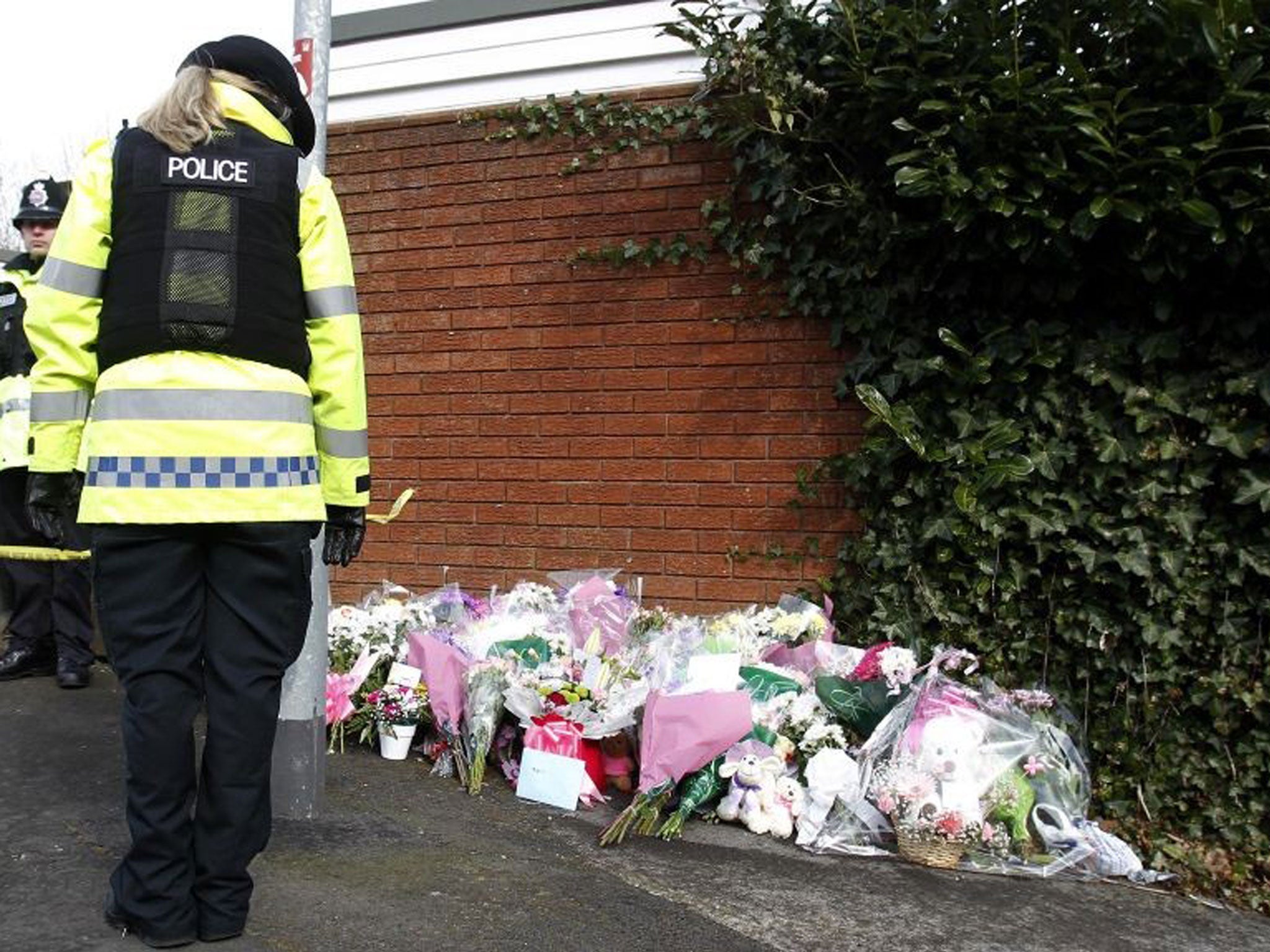 A policewoman stands near the scene where a 14 year old Jade Anderson was found dead believed to have been killed by a pack of dogs in Atherton, Greater Manchester