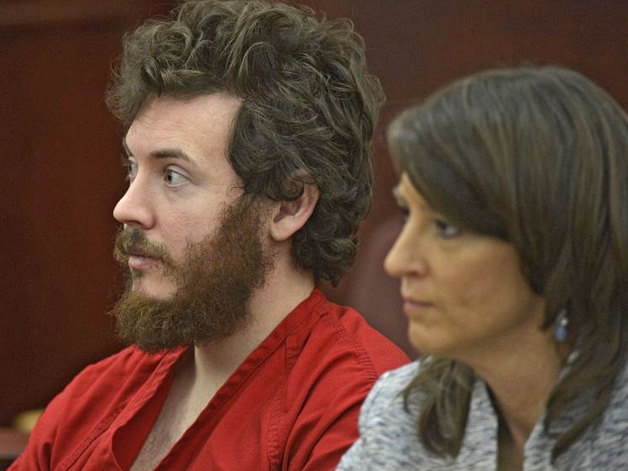 James Holmes, left, and defense attorney Tamara Brady appear in district court in Centennial, Colorado for his arraignment