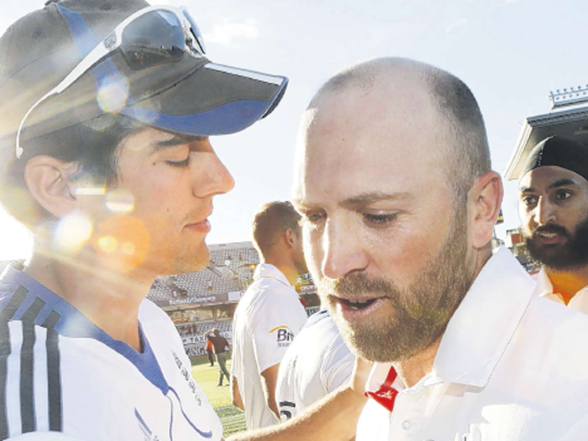 England’s Matt Prior gets a hug from captain Alastair Cook (left) after saving the Test series against New Zealand in Auckland