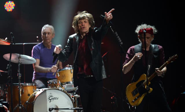 The Rolling Stones, Charlie Watts (L), Mick Jagger (C) and Keith Richards (R) perform during '12-12-12 The Concert For Sandy Relief' December 12, 2012 at Madison Square Garden in New York.