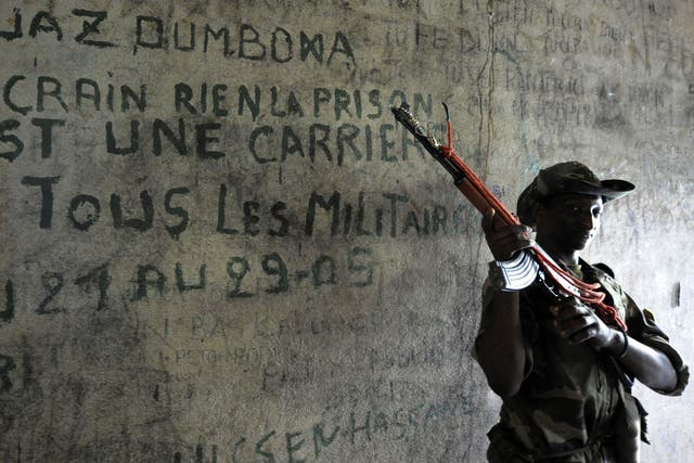 A rebel fighter guards a prison cell in Bangui 