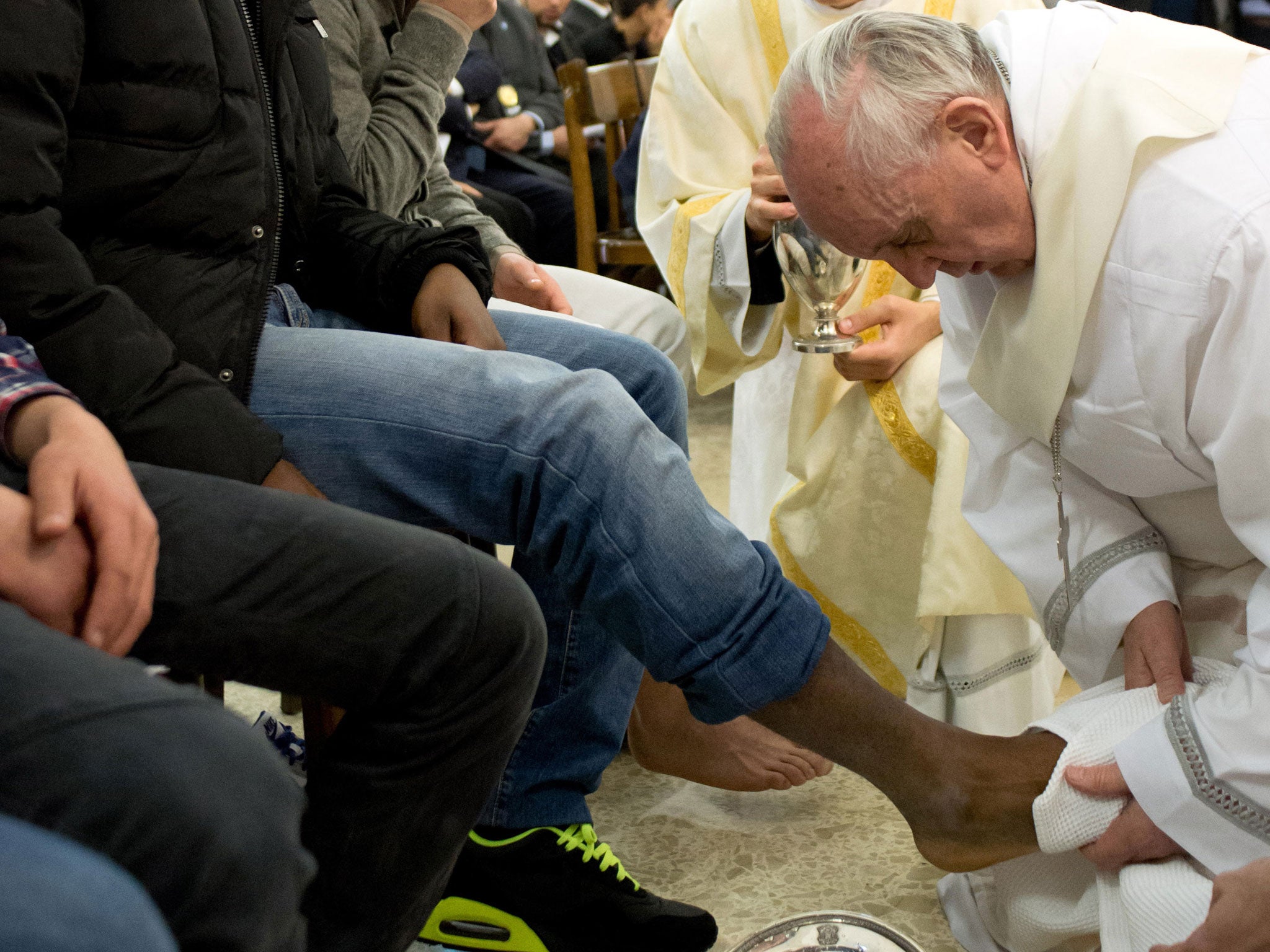 Pope Francis washes the feet of a prisoner at the Casal Del Marmo Youth Detention Centre