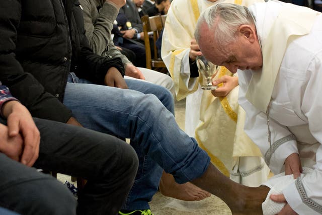 Pope Francis washes the feet of a  prisoner at the Casal Del Marmo Youth Detention Centre 