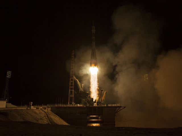 A trio of astronauts have broken the record for the quickest journey to the International Space Station, arriving there just six hours after setting off from a launch pad in Kazakhstan.