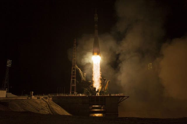A trio of astronauts have broken the record for the quickest journey to the International Space Station, arriving there just six hours after setting off from a launch pad in Kazakhstan.