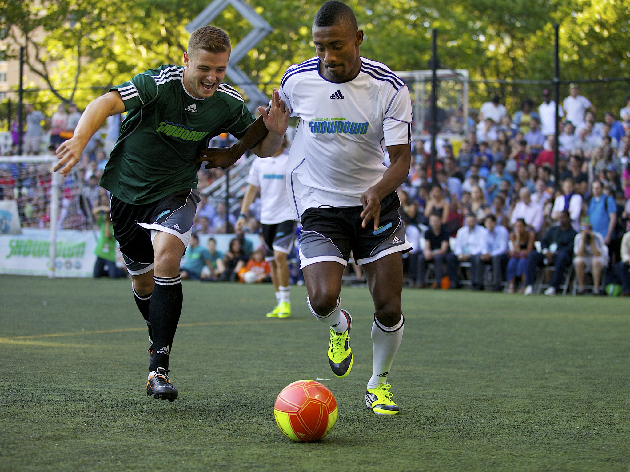 Robbie Rogers (left) takes on Chelsea’s Salomon Kalou in a charity event during the former’s time at Leeds