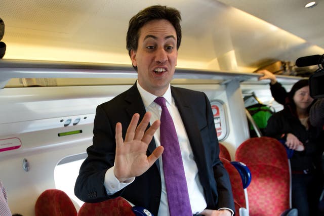 Ed Miliband talking to voters on a train to Carlisle
