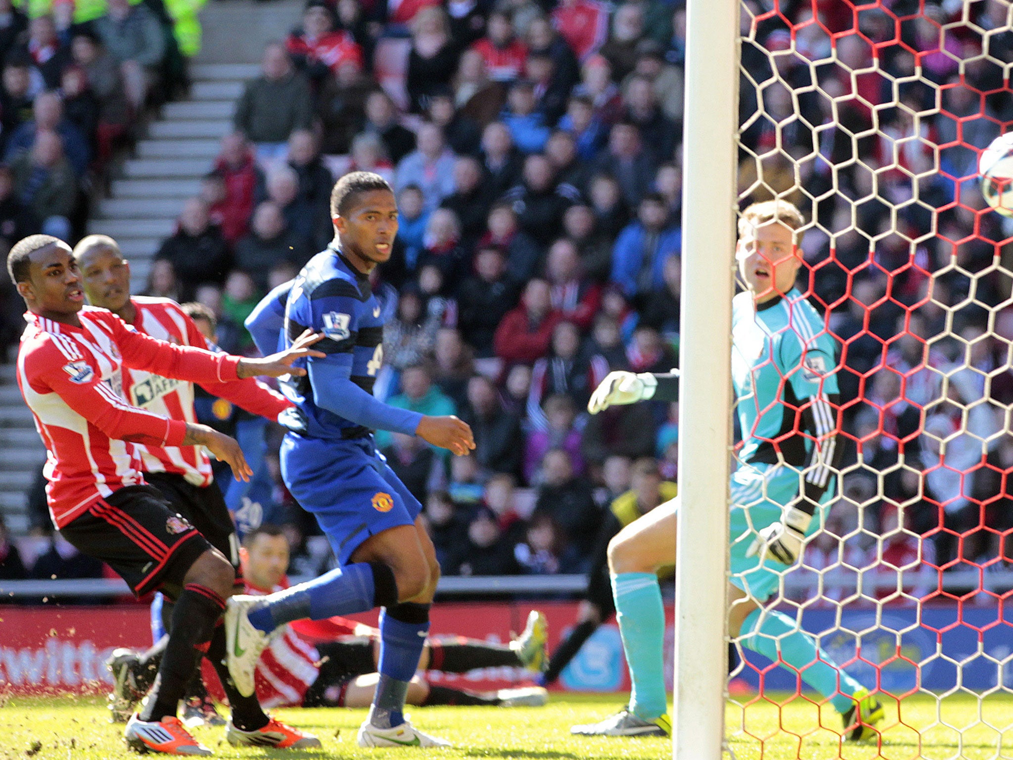 Manchester United's Dutch striker Robin van Persie (not pictured) scores the opening goal via a deflection off Sunderland's English defender Titus Bramble