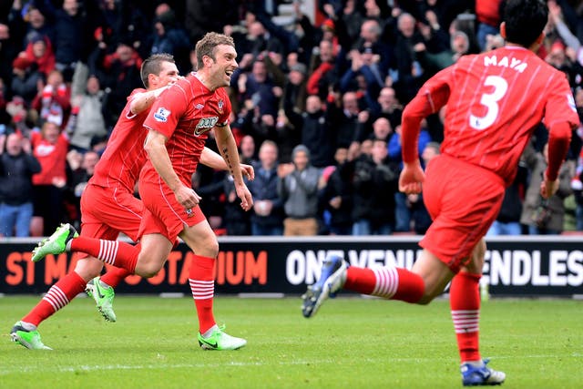 Rickie Lambert (2nd L) of Southampton celebrates with teammates after scoring his team's second goal