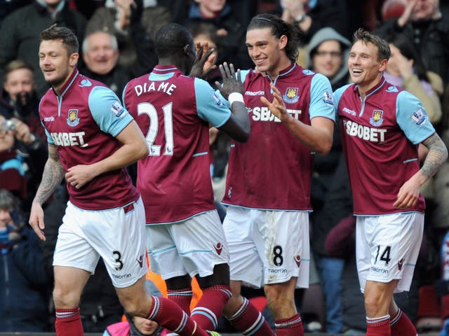 Andy Carroll of West Ham United (C) celebrates scoring his second goal