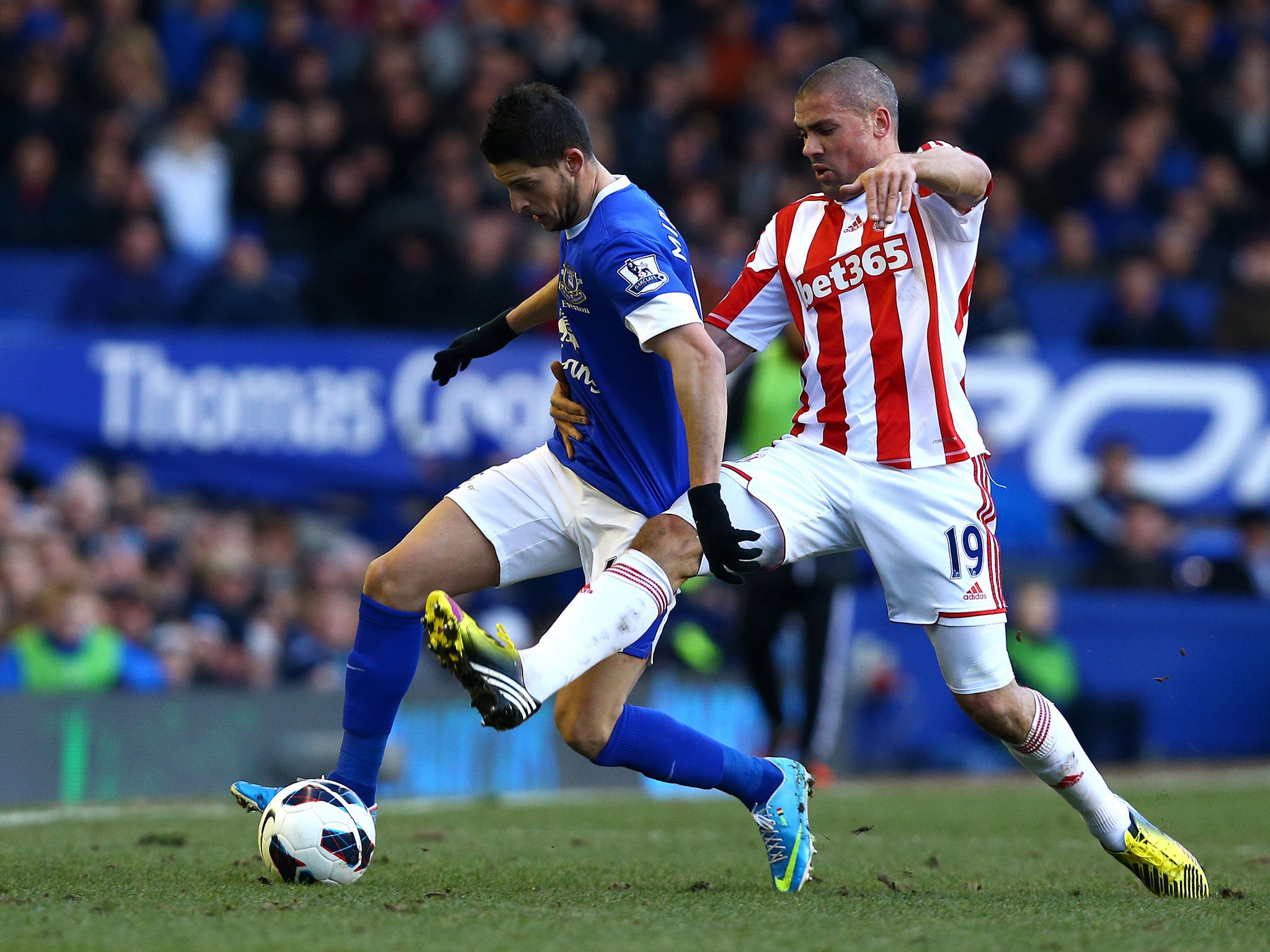 Kevin Mirallas of Everton battles with Jonathan Walters of Stoke City