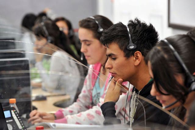 Young telemarketers work in a call center in Manizales, Caldas Department, Colombia
