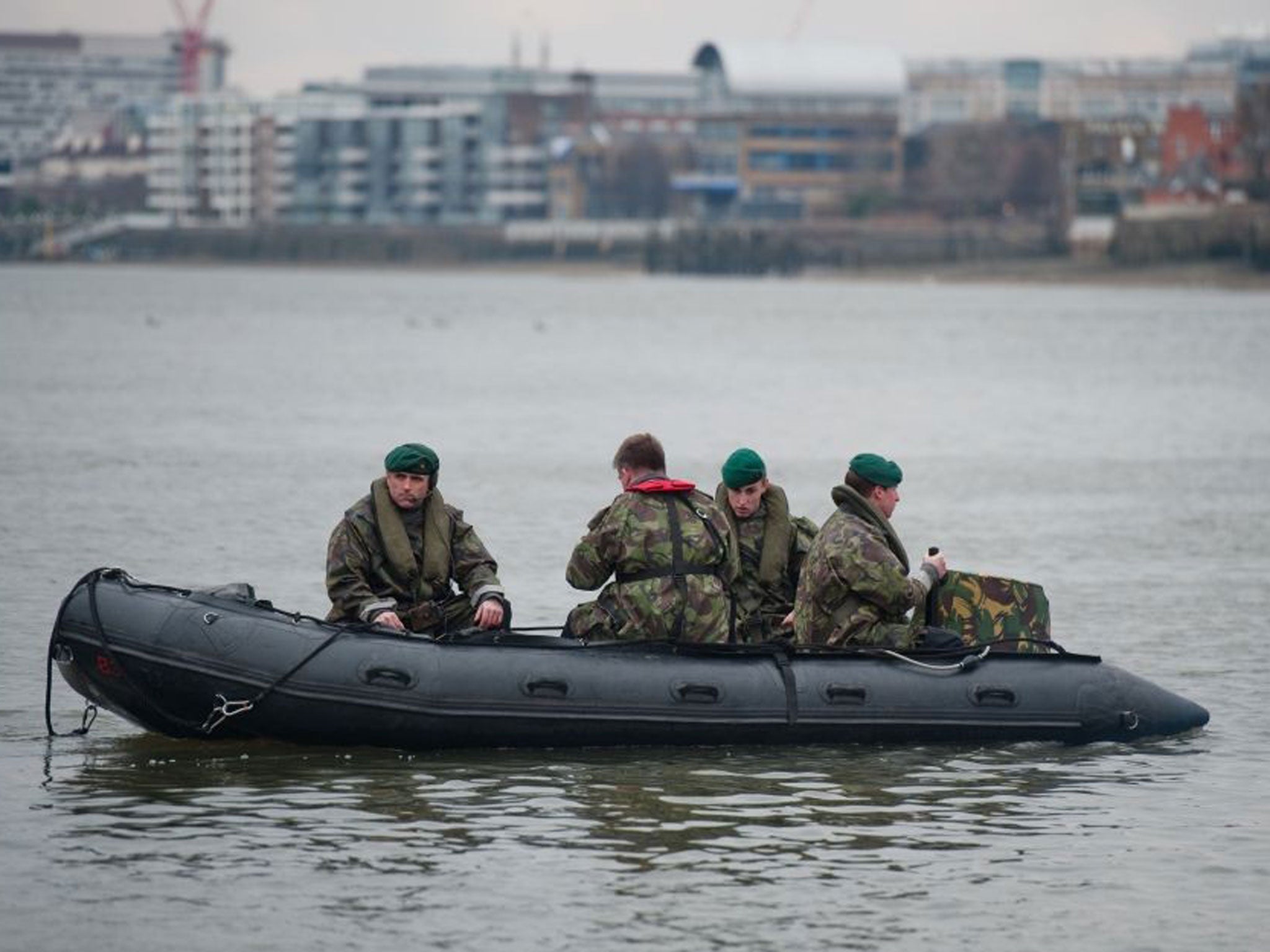 Royal Marines go through security preparation on the River Thames