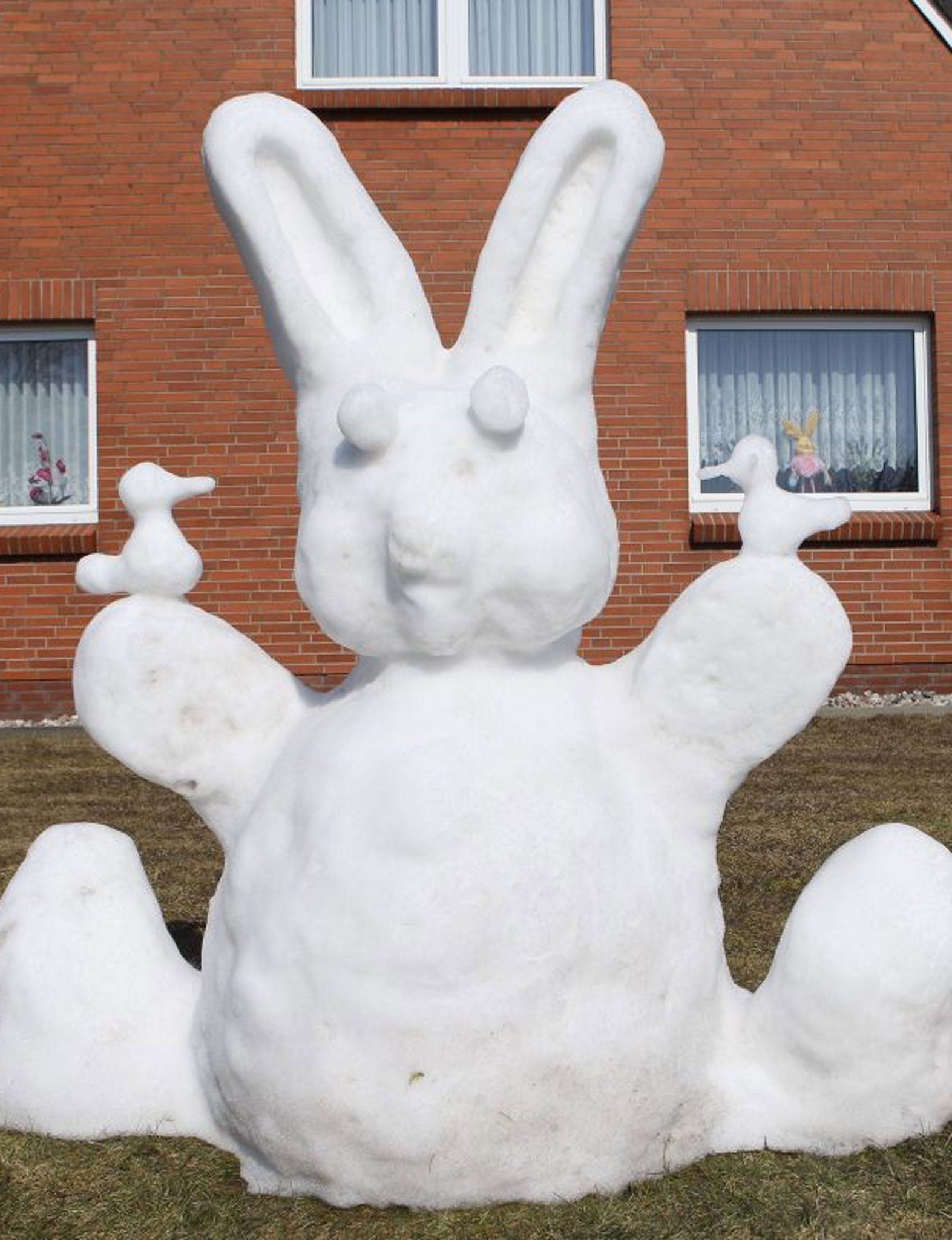 An Easter bunny made of snow in a garden in Oster-Ohrstedt, northern Germany today