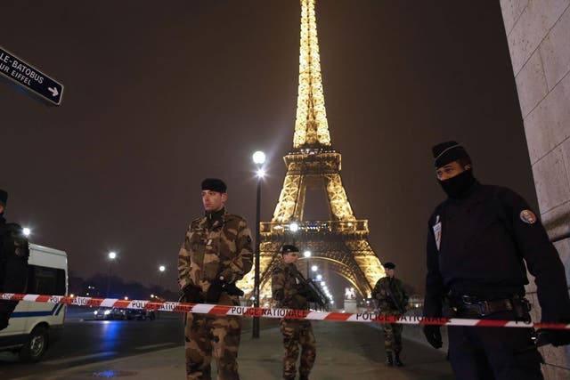 Paris' Eiffel Tower was cordoned off yesterday after an anonymous call about an attack