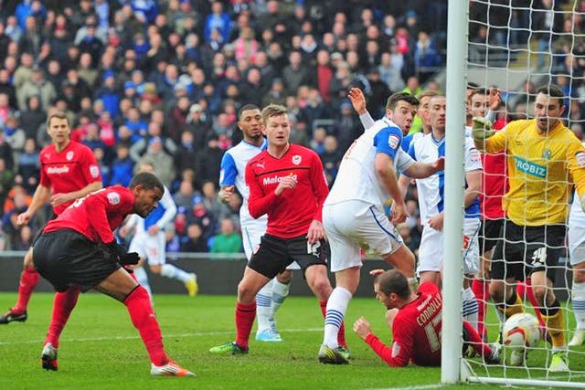 Cardiff City forward Fraizer Campbell (far left) heads home the opener in todays’s emphatic win