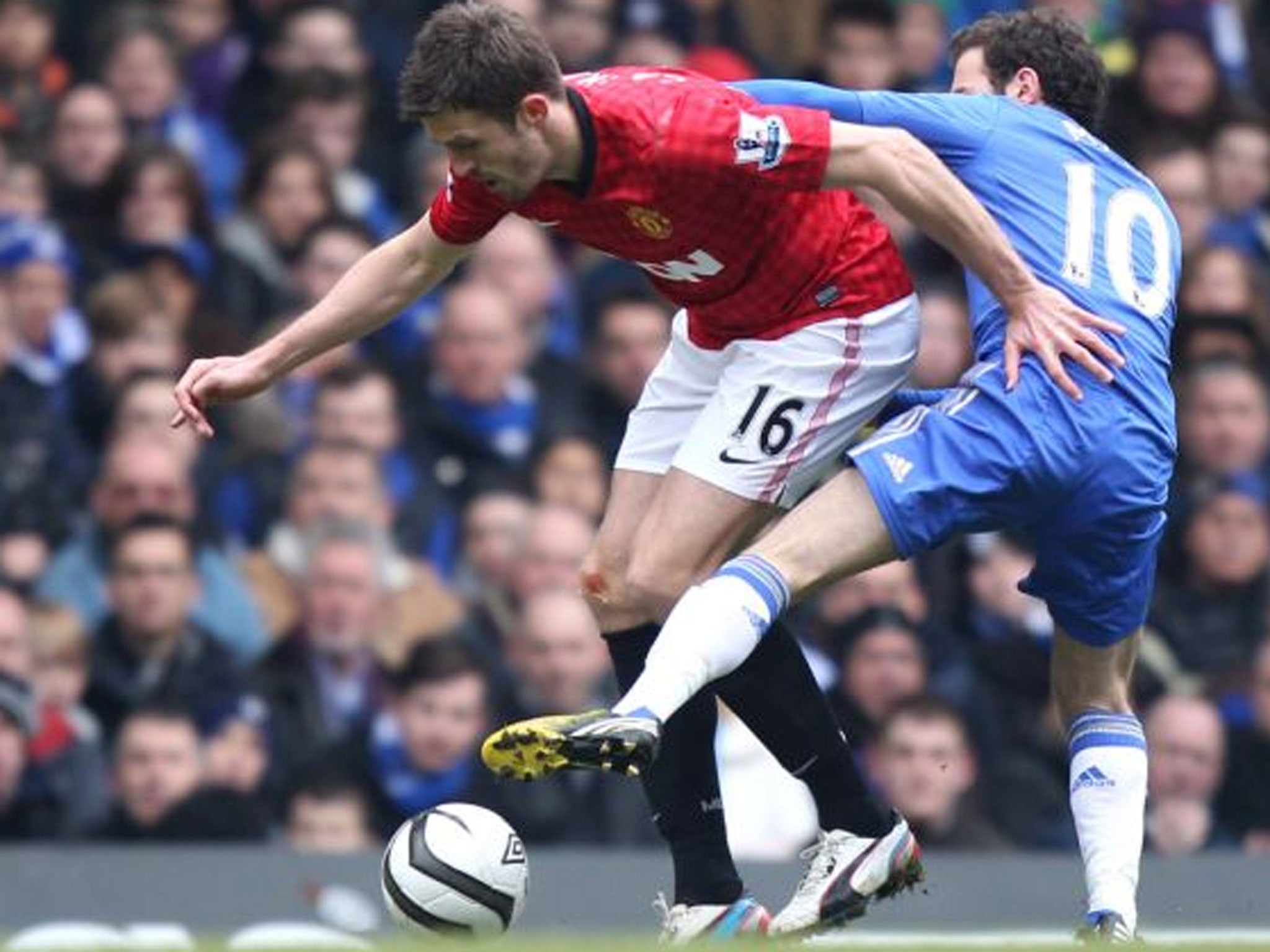 Michael Carrick (left) tangles with Juan Mata but the United
midfielder was unable to assert himself at Stamford Bridge