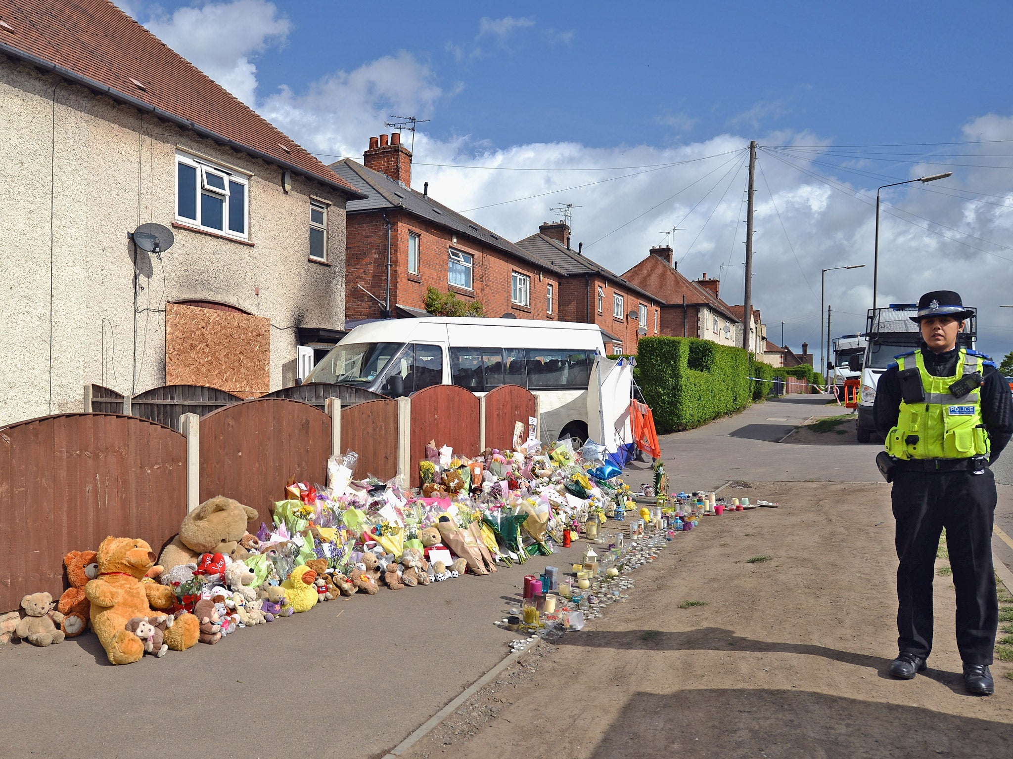 Floral tributes adorned the pavement outside the Philpott home in Allenton following the fire