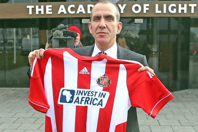 Paolo Di Canio poses with a club shirt after being unveiled as the new Sunderland manager