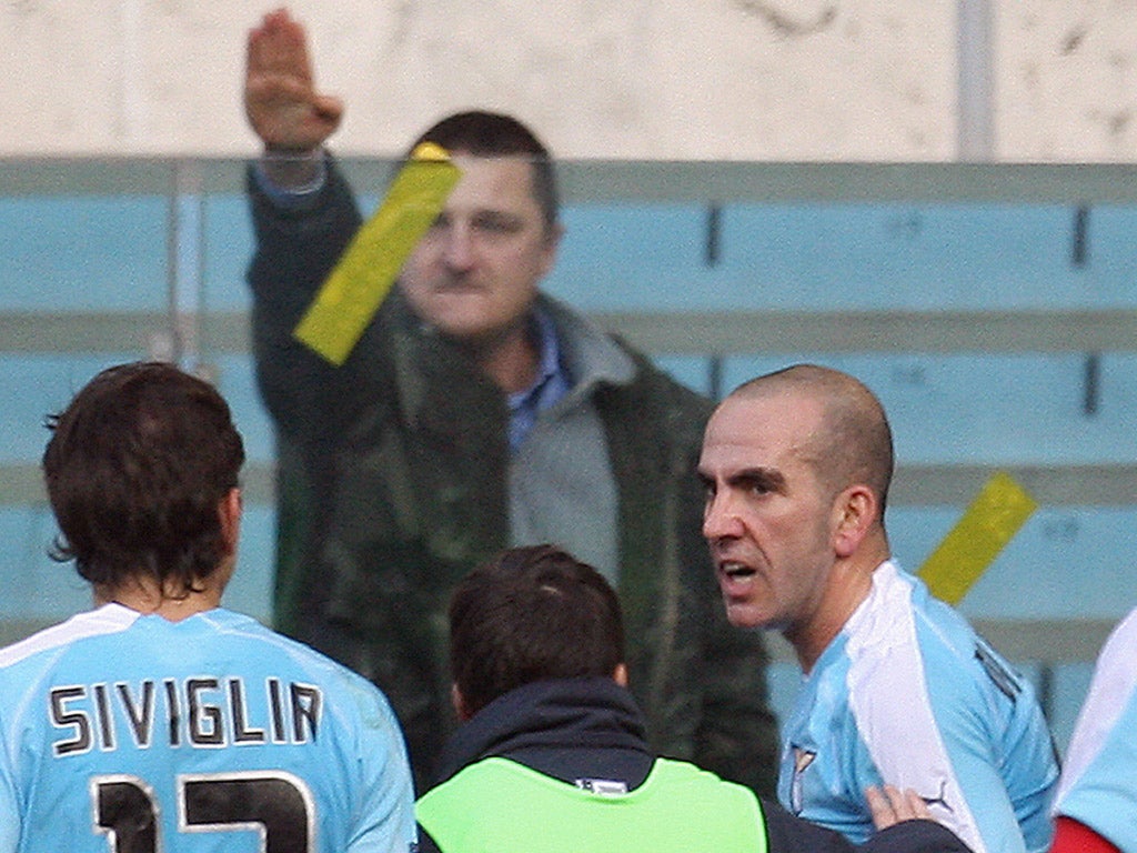 A Lazio supporter makes the fascist salute after Di Canio scores a goal for the Serie A club in 2006
