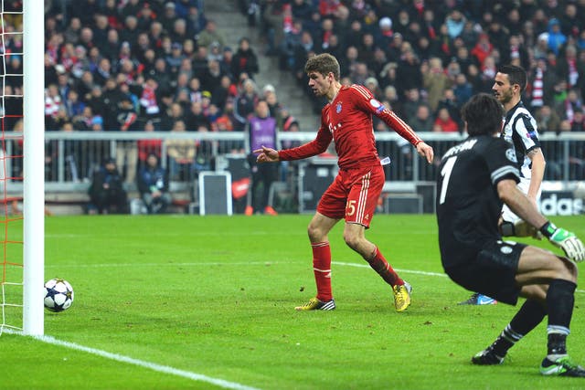 Thomas Muller slots in Bayern's second against Juventus in the first leg