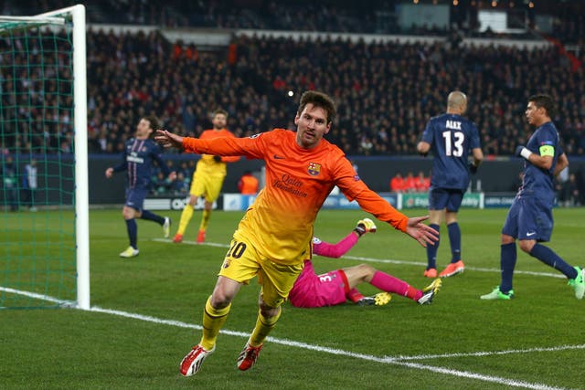 Barcelona forward Lionel Messi scores against PSG in the Champions League