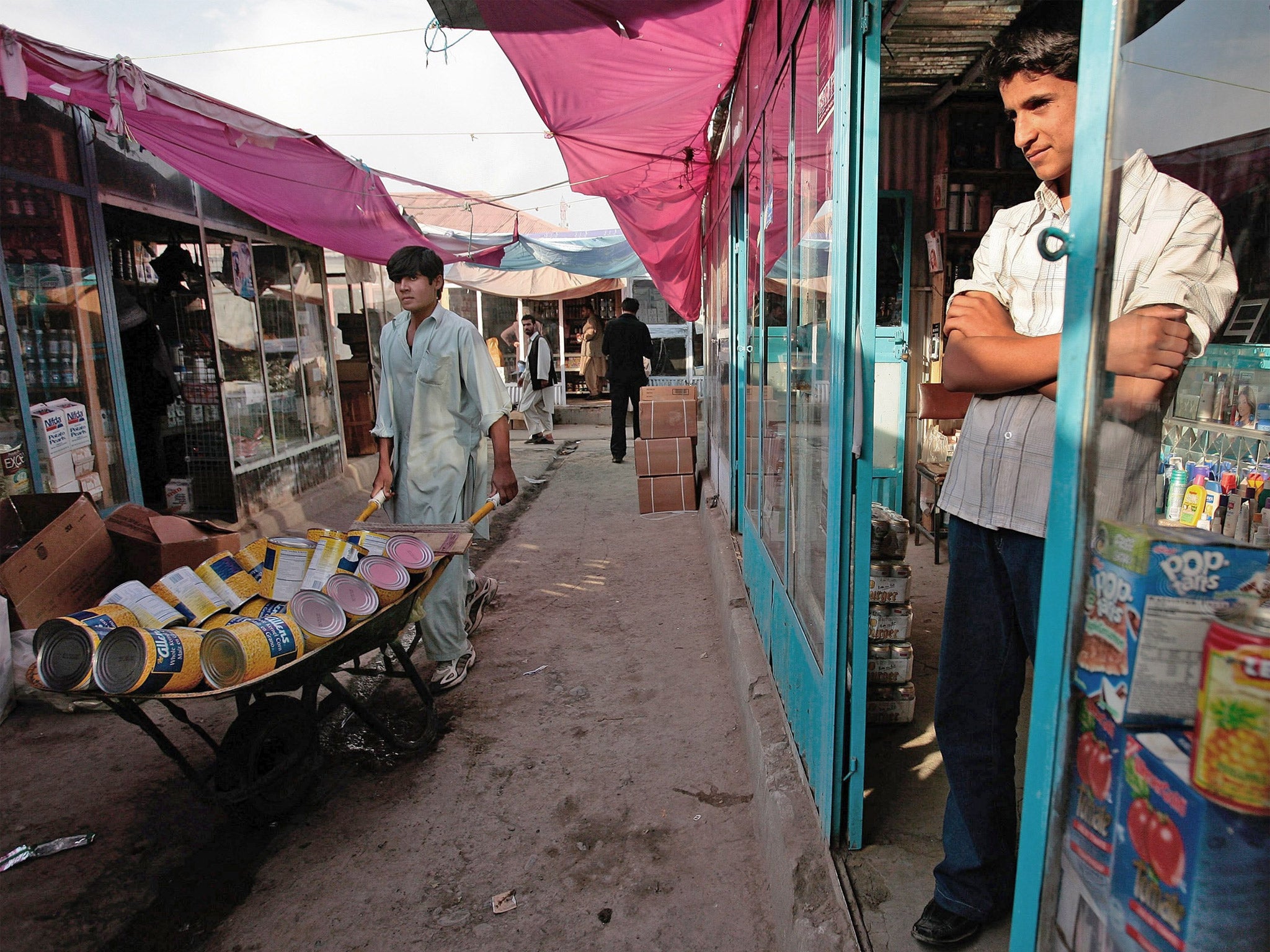 A merchant waits for business at the Bush Bazaar in Kabul, Afghanistan
