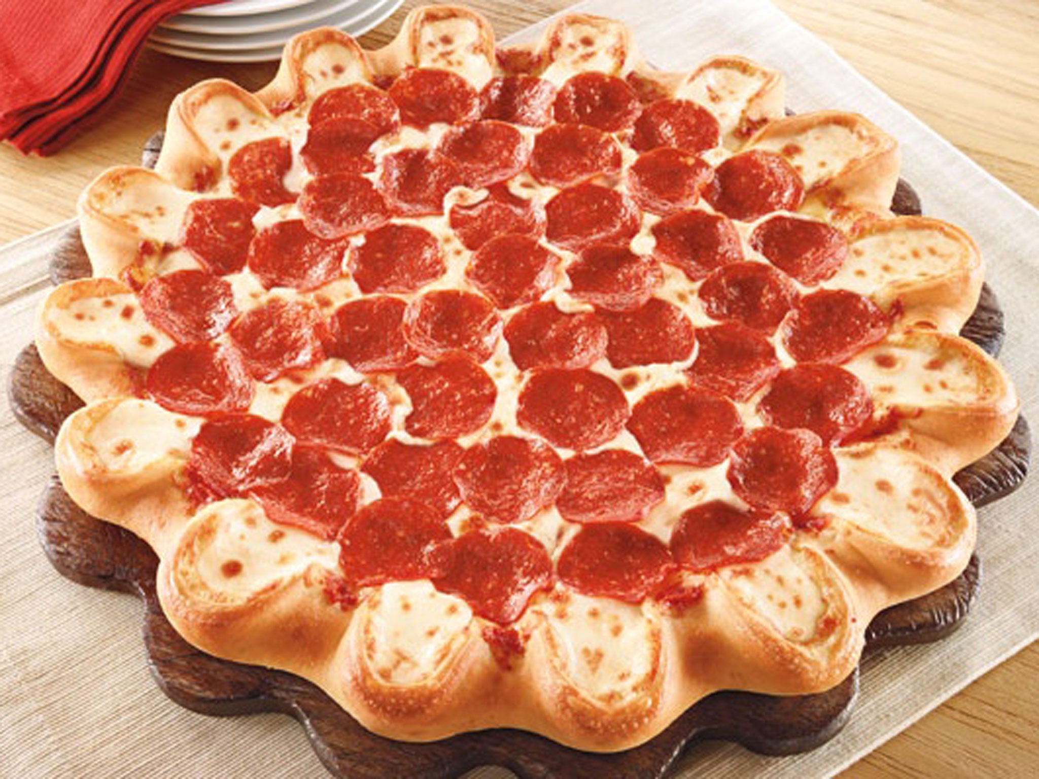 Pizza Hut's new pizza has handmade pockets of molten mozzarella, provolone, fontina, mild cheddar and other cheeses around the rim.