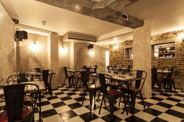 Garufin is a bit of a downstairs dungeon, with its grey-brown wallpaper, dim lights, naked brickwork and chequered flooring