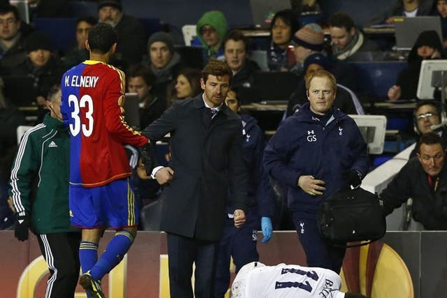 Andre Villas-Boas looks worried as Gareth Bale lies injured