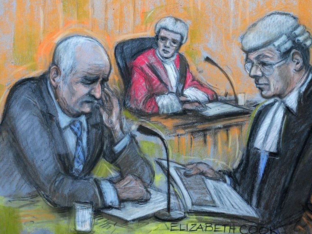 Court drawing of Mick Philpott (left) in the witness box at Nottingham Crown Court