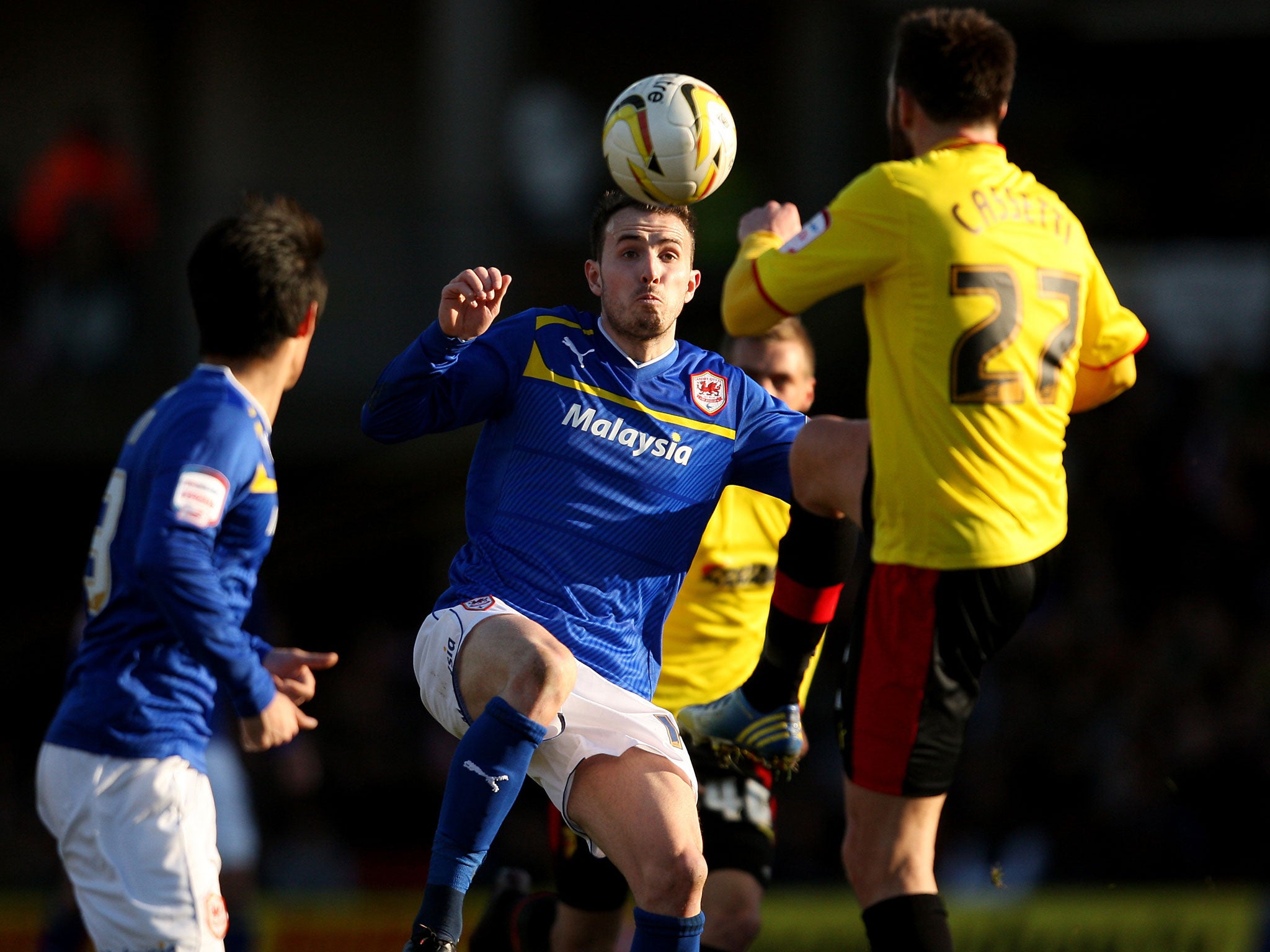 Kneesy does it: Mutch of Cardiff (left) tangles with Watford’s Cassetti