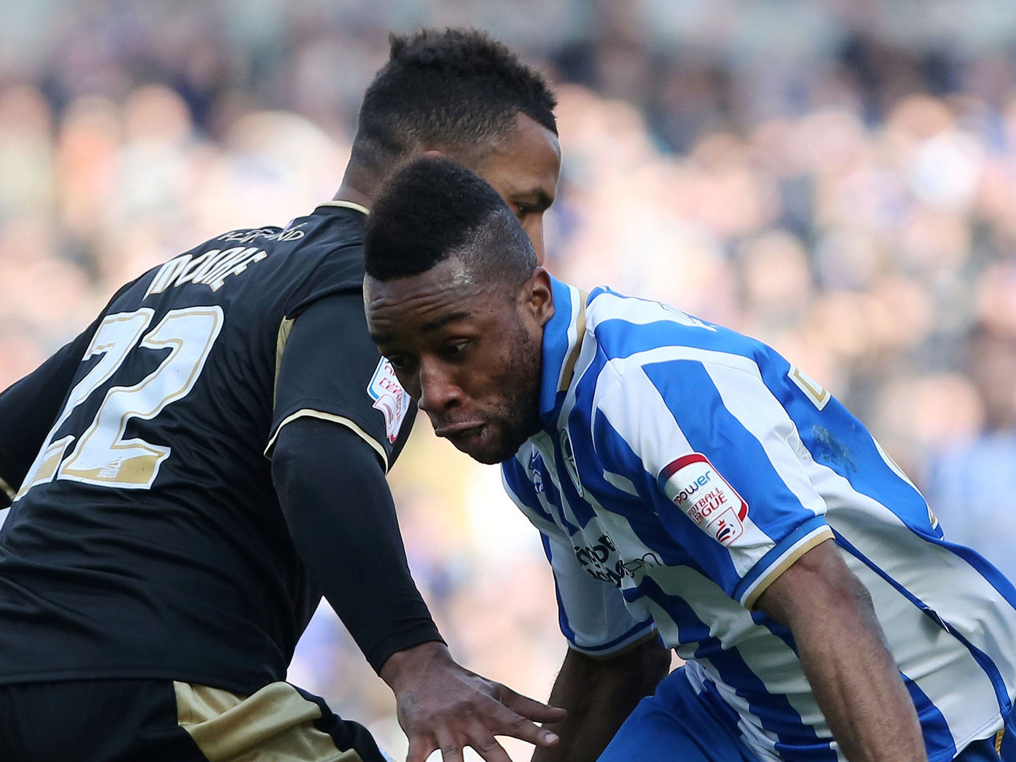 Outfoxed: Kazenga LuaLua goes past the Leicester defender Liam Moore