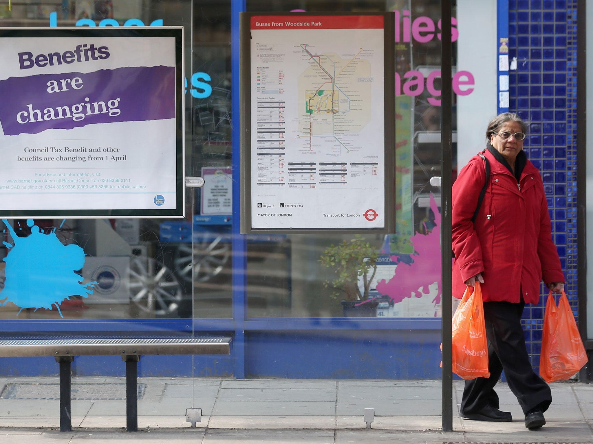 Hitting home: A bus-shelter poster warns of changes to the benefits system