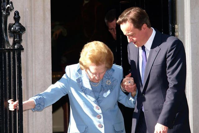Prime Minister David Cameron helping Baroness Thatcher outside Downing Street