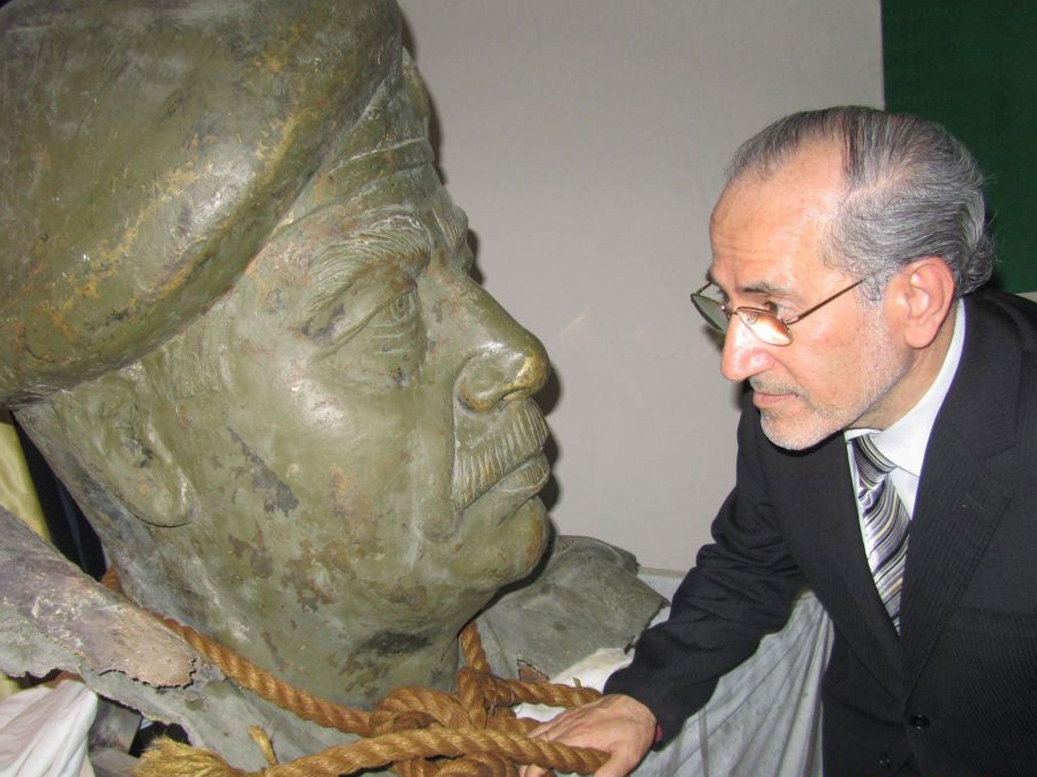 Dr Mowaffak al-Rubaie with a bust of the deposed dictator from one of his palaces and the rope used to hang him