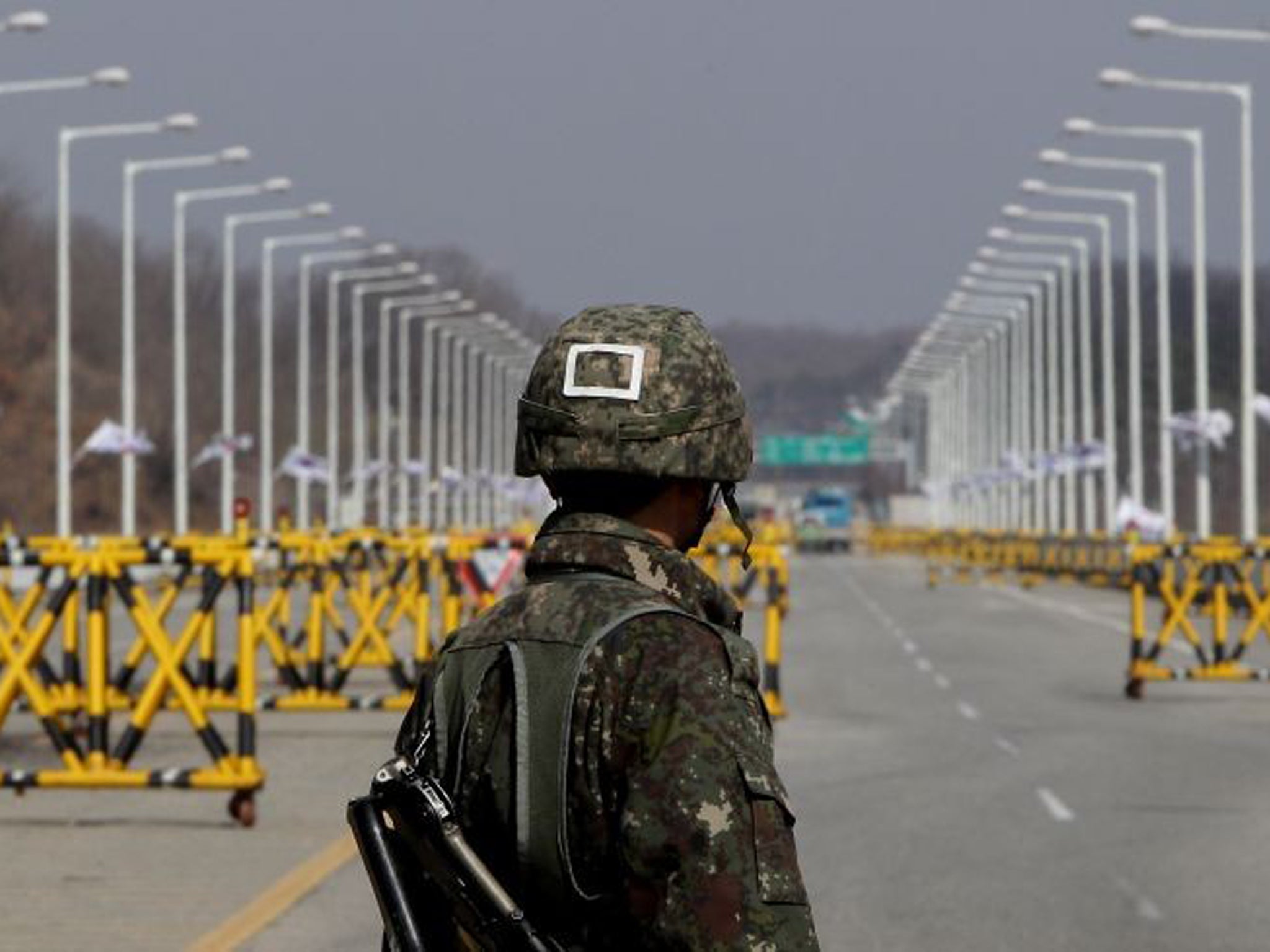 A South Korean soldier stands at a military check point connecting South and North Korea at the Unification Bridge in Paju, South Korea