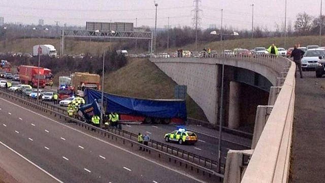 The scene after a HGV driver had a lucky escape after his lorry left the flyover on the M42 and crashed onto the M6 toll near Coleshill in Warwickshire