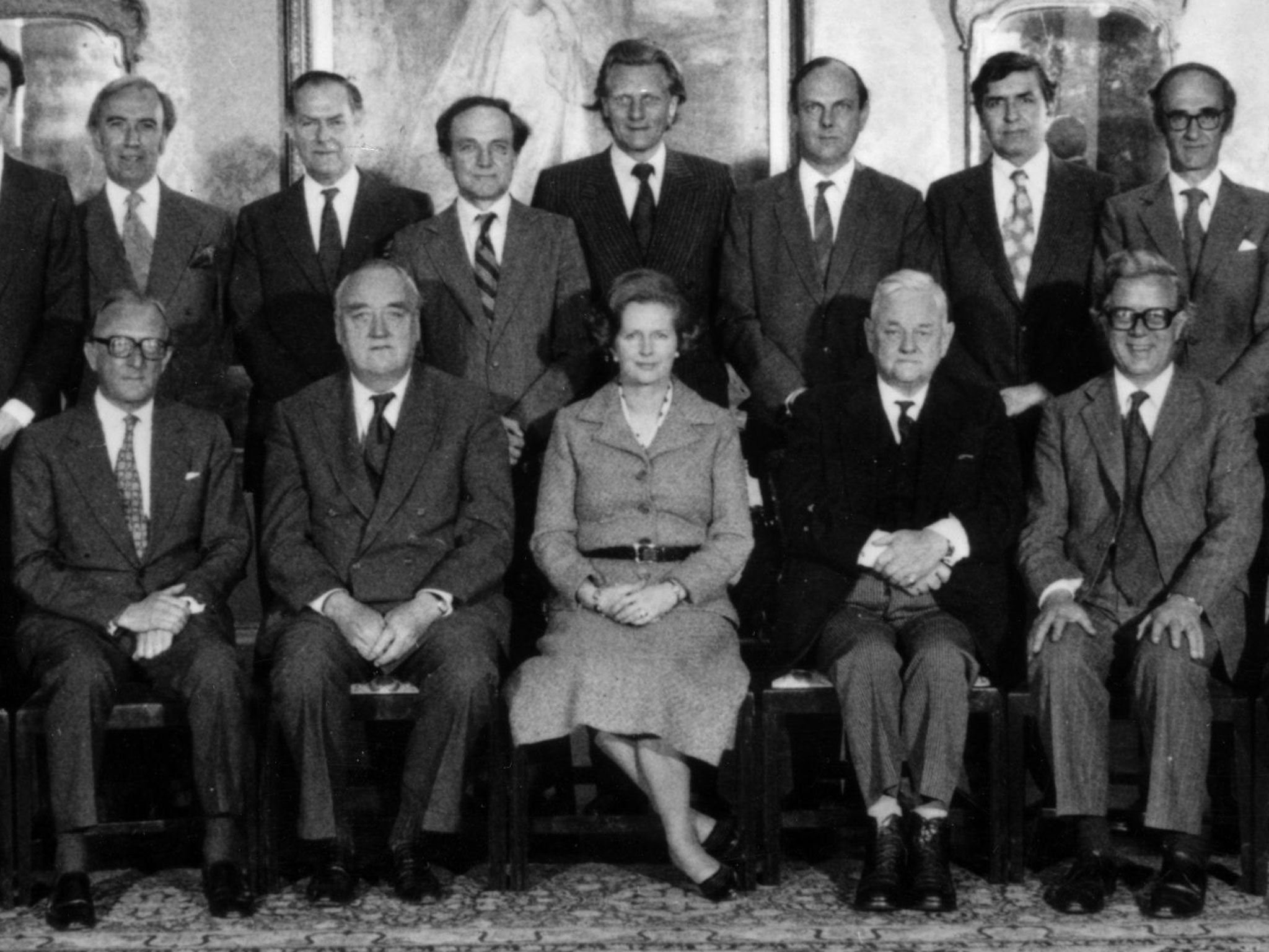 21st June 1979: British Prime Minister Margaret Thatcher sits with her new Cabinet at No 10 Downing Street in London. Left to right (standing): - David Howell, Energy Secretary; Norman St John Stevas, Chancellor of the Duchy of Lancaster; Humphrey Atkins, Northern Ireland Secretary; George Younger, Scottish Secretary; Michael Heseltine, Environment Secretary; Nicholas Edwards, Welsh Secretary; Patrick Jenkin, Social Services Secretary; John Nott, Trade Secretary. Left to right (seated): - Lord Carrington, Foreign Secretary and Overseas Development; William Whitelaw, Home Secretary; Margaret Thatcher, Prime Minister; Lord Hailsham, Lord Chancellor; Sir Geoffrey Howe, Chancellor of the Exchequer