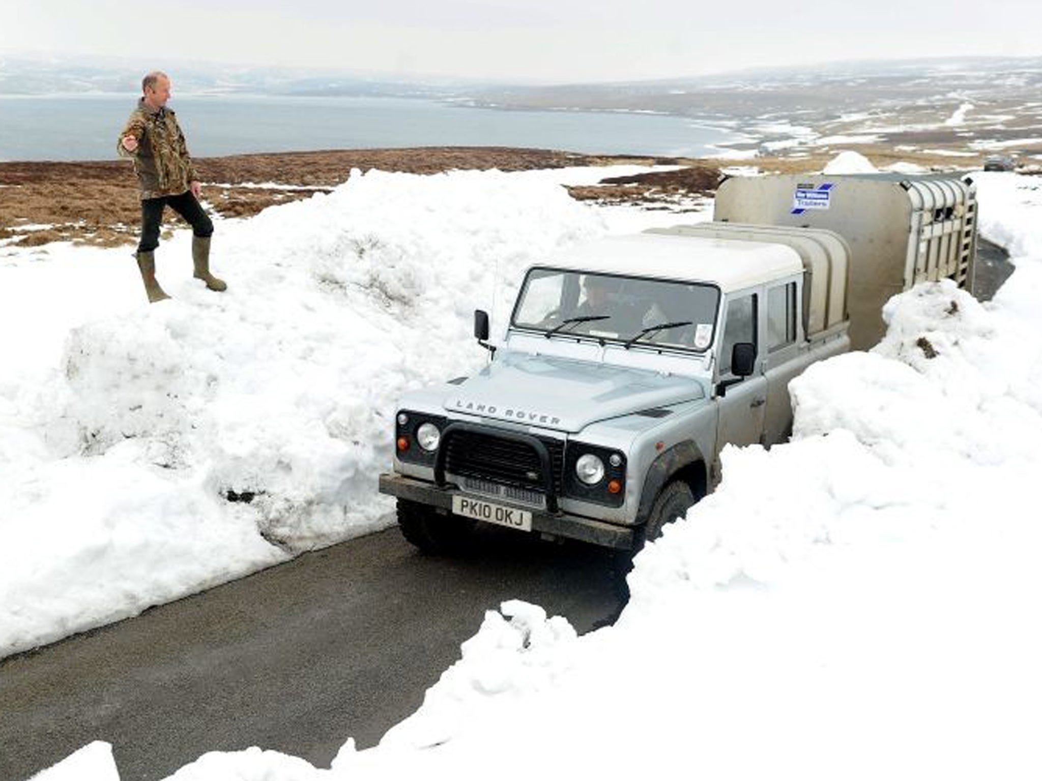 A car travels through the snow near Allenheads in Northumberland in April